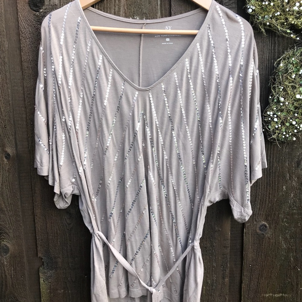 Dolman sleeve, belted sequin top